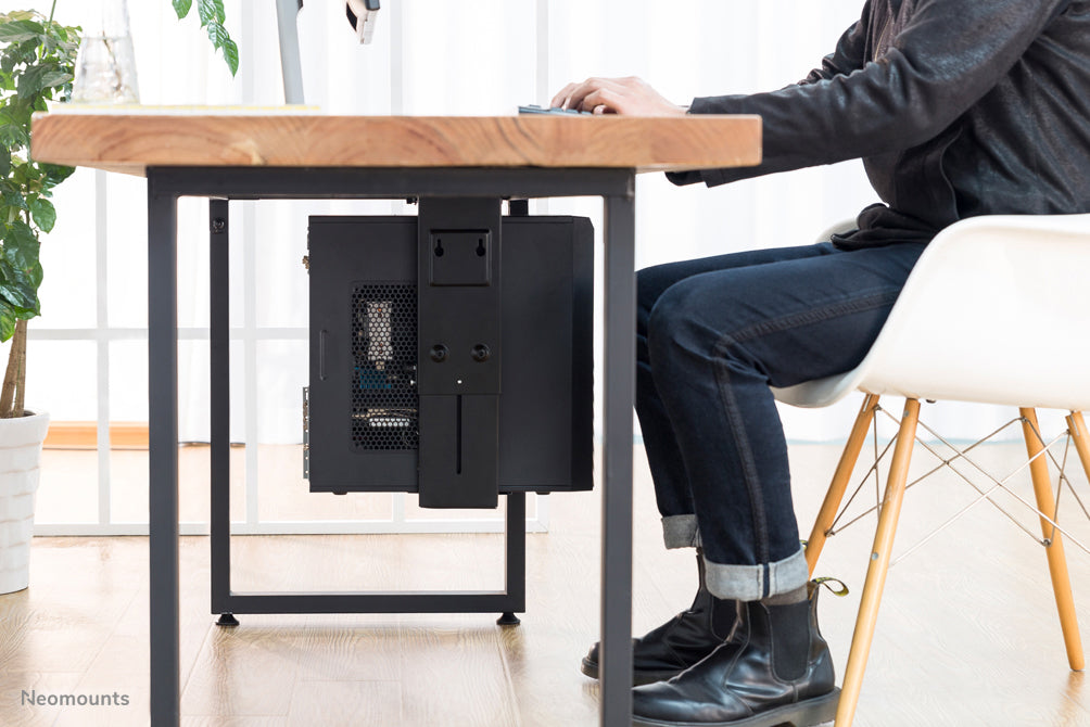 NM-CPU100BLACK is a support that allows you to attach a PC or thin client to the desk.