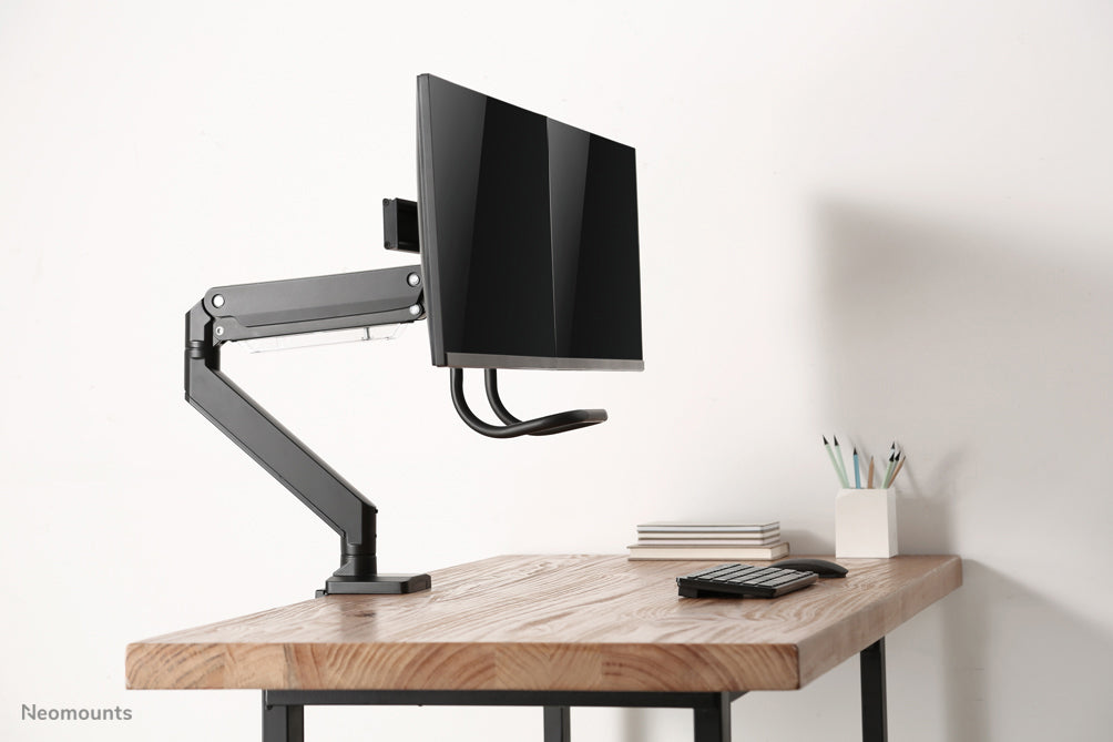 NM-D775DXBLACK is a gas-suspended desk support with crossbar and lever for flat screens up to 32 inches (81 cm).